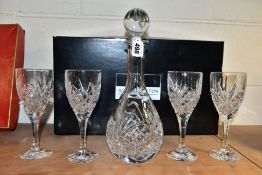 A BOXED ROYAL DOULTON CRYSTAL WINE DECANTER SET, comprising four wine glasses and a baluster