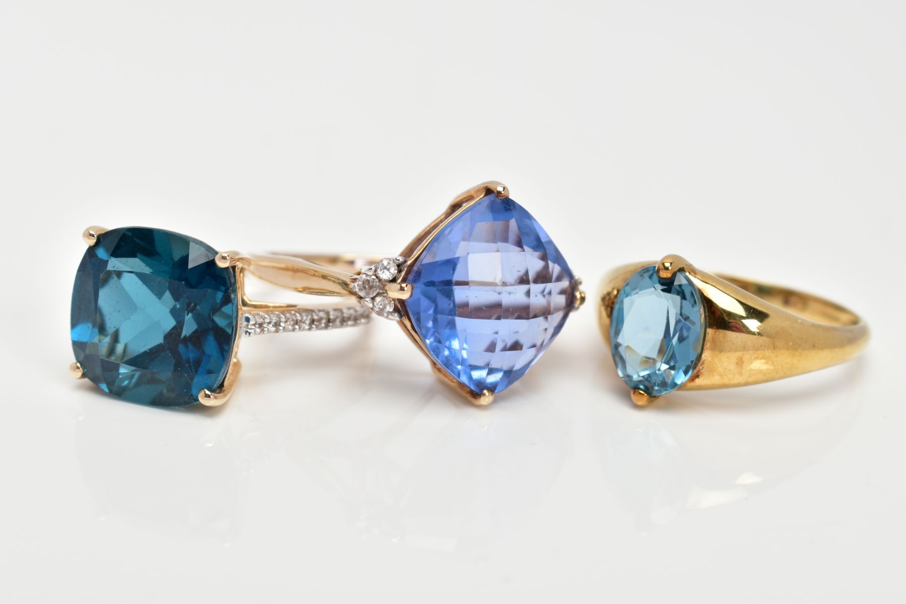 THREE 9CT GOLD GEM SET DRESS RINGS, each set with a vary cut blue stone possibly topaz/fluorite - Image 2 of 3