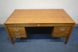 A MID 20TH CENTURY TEAK OFFICE DESK, a bank of three drawers and deep drawer opposing, width 153cm x