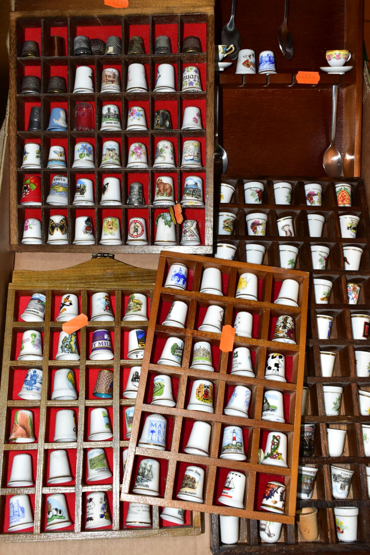 A BOX OF APPROXIMATELY ONE HUNDRED AND FORTY EIGHT THIMBLES IN WOODEN DISPLAY CASES, mostly