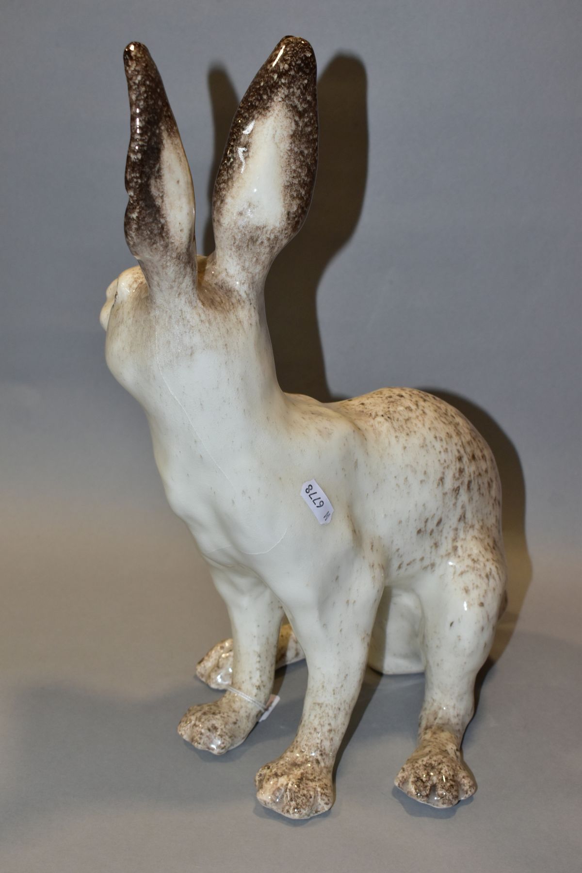 A WINSTANLEY POTTERY CREAM AND MOTTLED BROWN FIGURE OF A SEATED HARE, glass eyes, painted marks to - Image 4 of 5