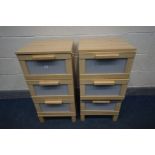 A PAIR OF MODERN BEECH EFFECT THREE DRAWER BEDSIDE CABINETS