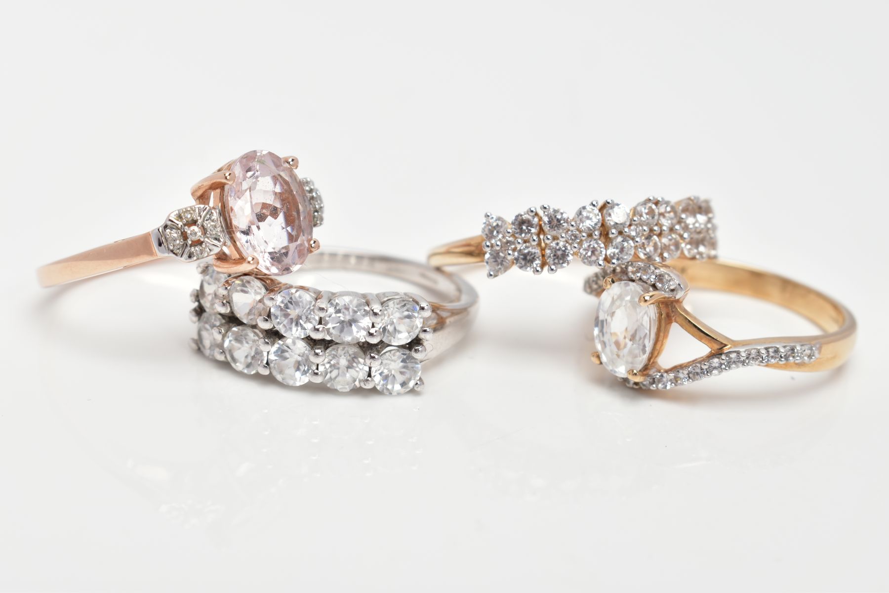 FOUR 9CT GOLD DRESS RINGS, the first a rose gold ring set with an oval cut morganite, flanked with - Image 2 of 3