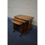 AN ERCOL GOLDEN DAWN NEST OF THREE TABLES, width 57cm x depth 36cm x height 43cm