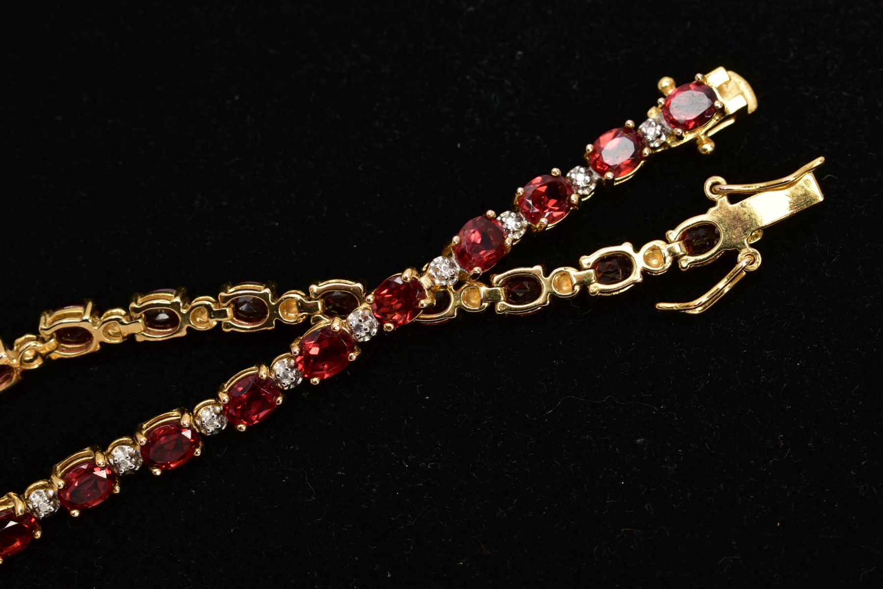 A SELECTION OF JEWELLERY, to include a silver gilt line bracelet, set with oval cut garnets, each - Image 3 of 9