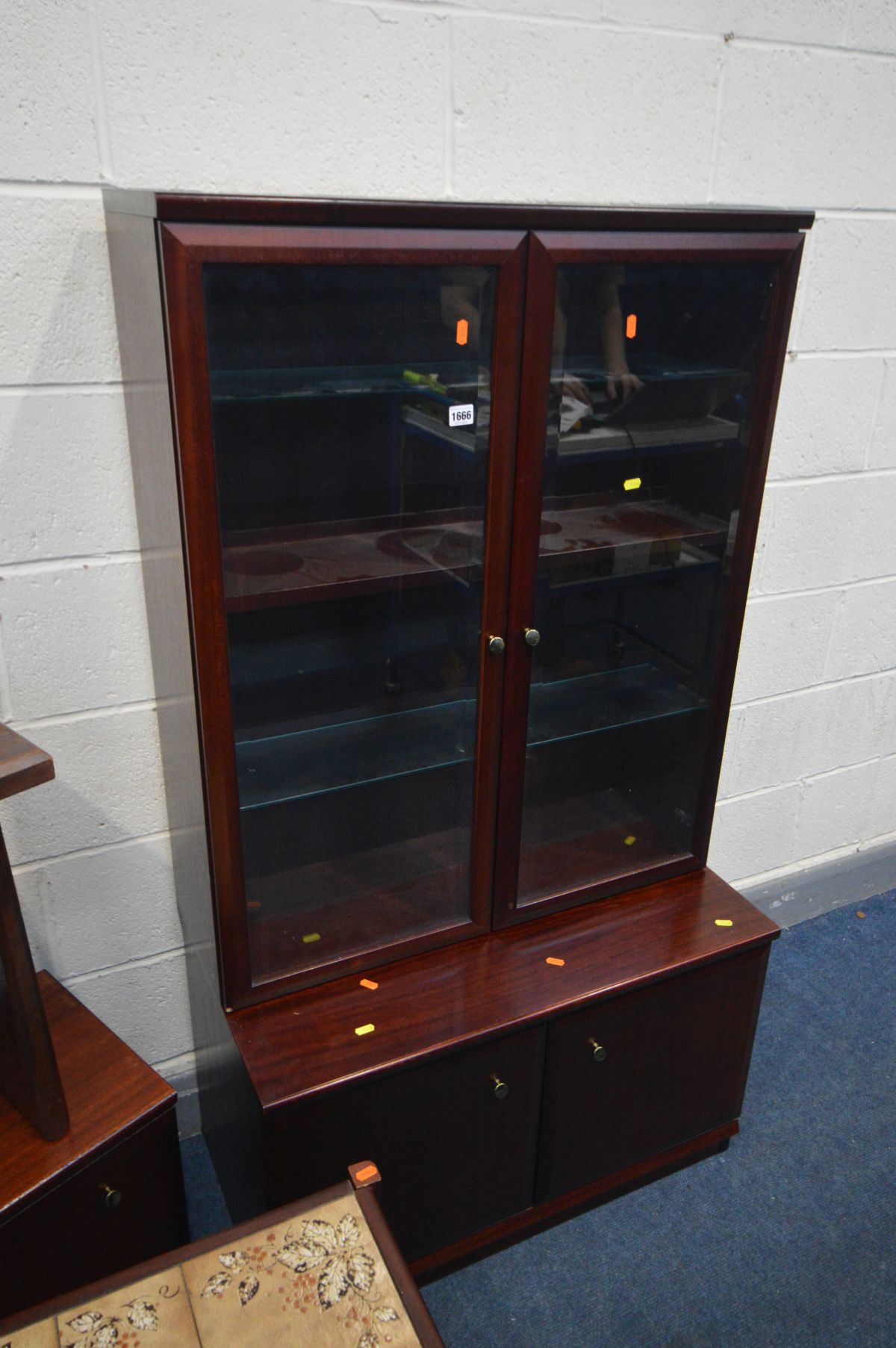 A MAHOGANY BOOKCASE, with a bevel edged double door unit top enclosing two glass shelves and - Image 2 of 2