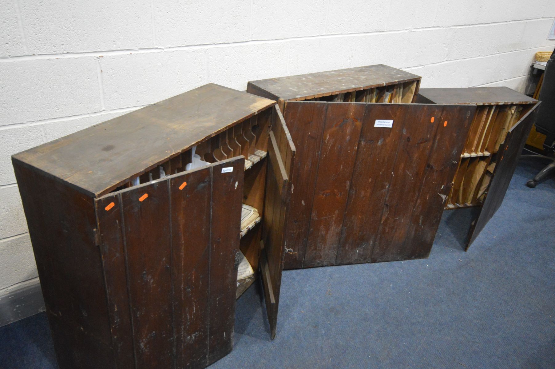 THREE STAINED PINE CABINETS, one with double cupboard doors enclosing three fixed shelves with