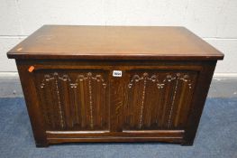 AN OAK LINENFOLD BLANKET CHEST, width 76cm x depth 43cm x height 46cm (condition:- heat ring mark to