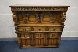 AN OLD CHARM OAK COURT CUPBOARD, with three drawers, width 137cm x depth 45cm x height 137cm