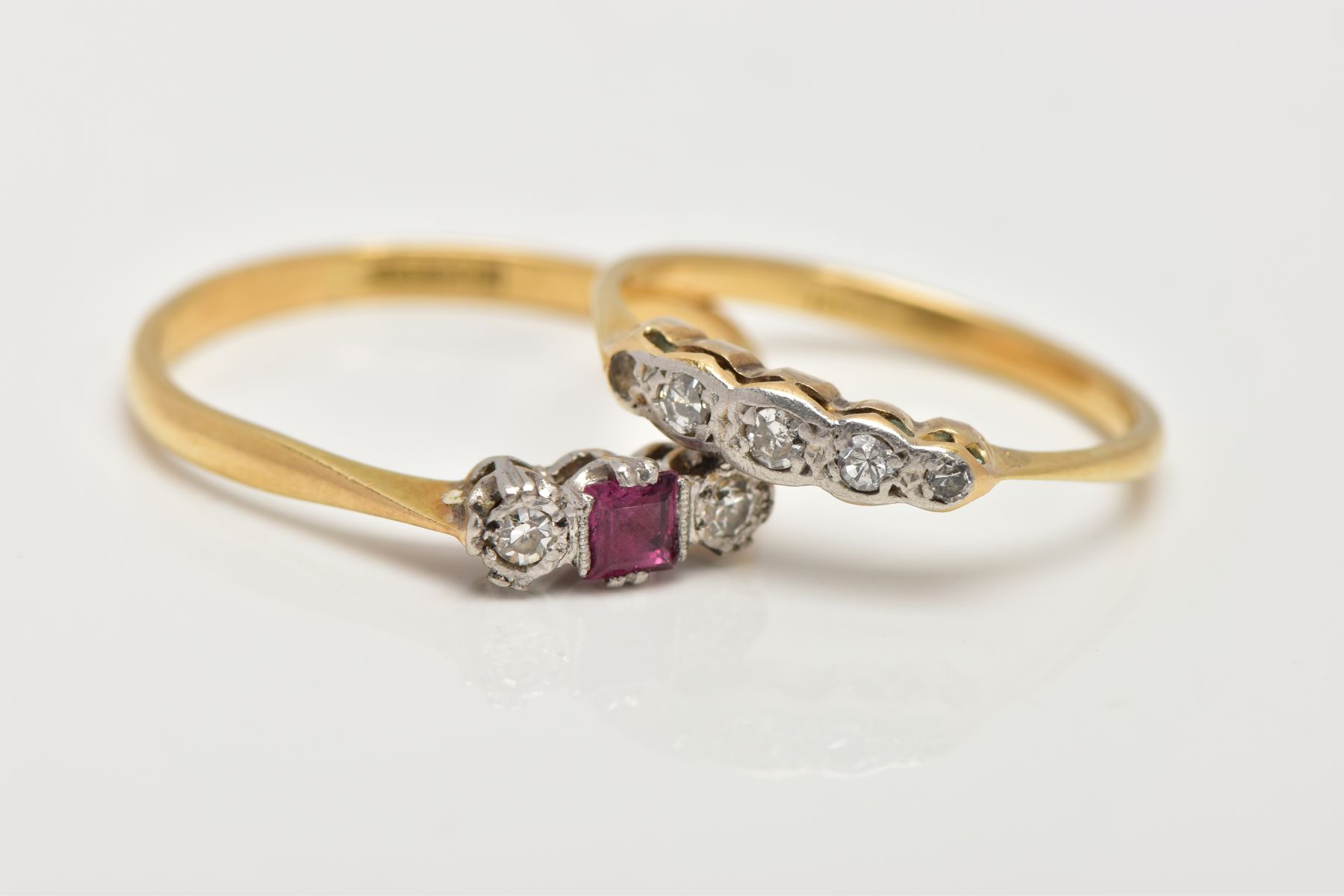 TWO YELLOW METAL DIAMOND RINGS, the first a three stone ring set with a central square cut ruby, - Image 2 of 3