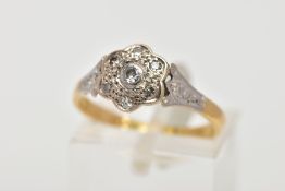 AN 18CT GOLD AND PLATINUM DIAMOND CLUSTER RING, the cluster of a flower shape, set with a central