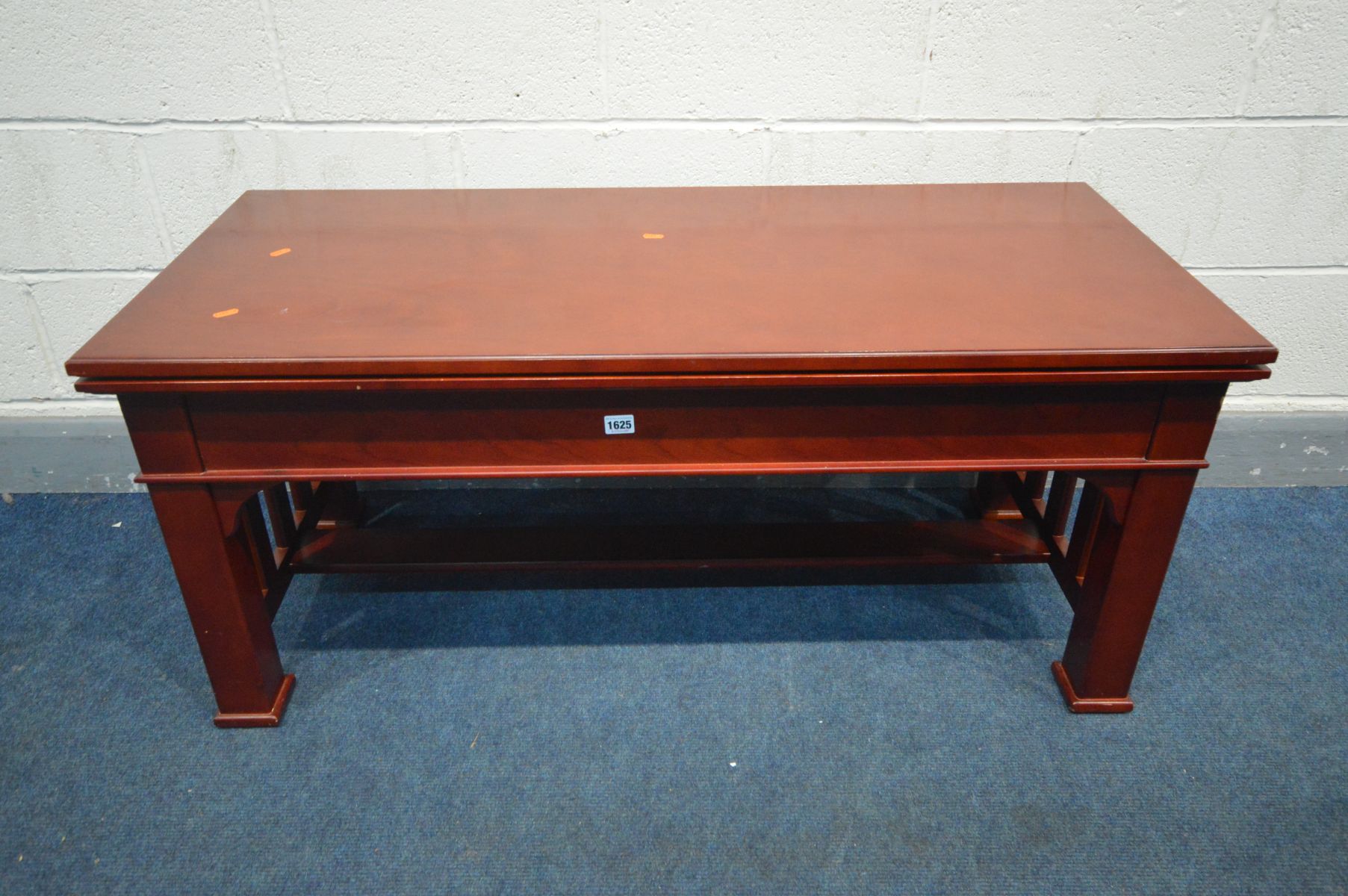 A JONNY TEXAS MAHOGANY FIVE IN ONE CASINO TABLE, with a coffee table top, roulette wheel, blackjack,