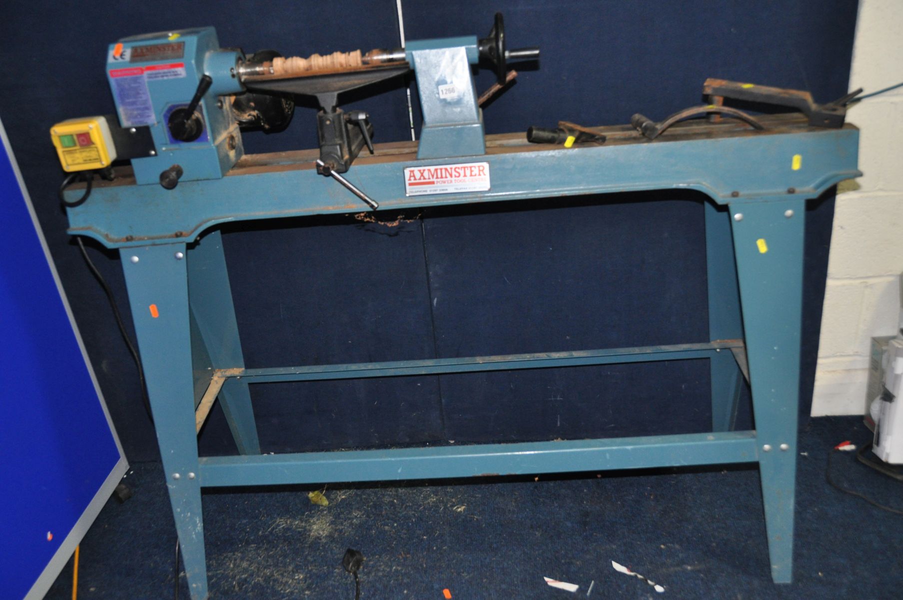 AN AXMINSTER APTC M950 WOODTURNING LATHE on stand, with three rests, a rest extension and a tray