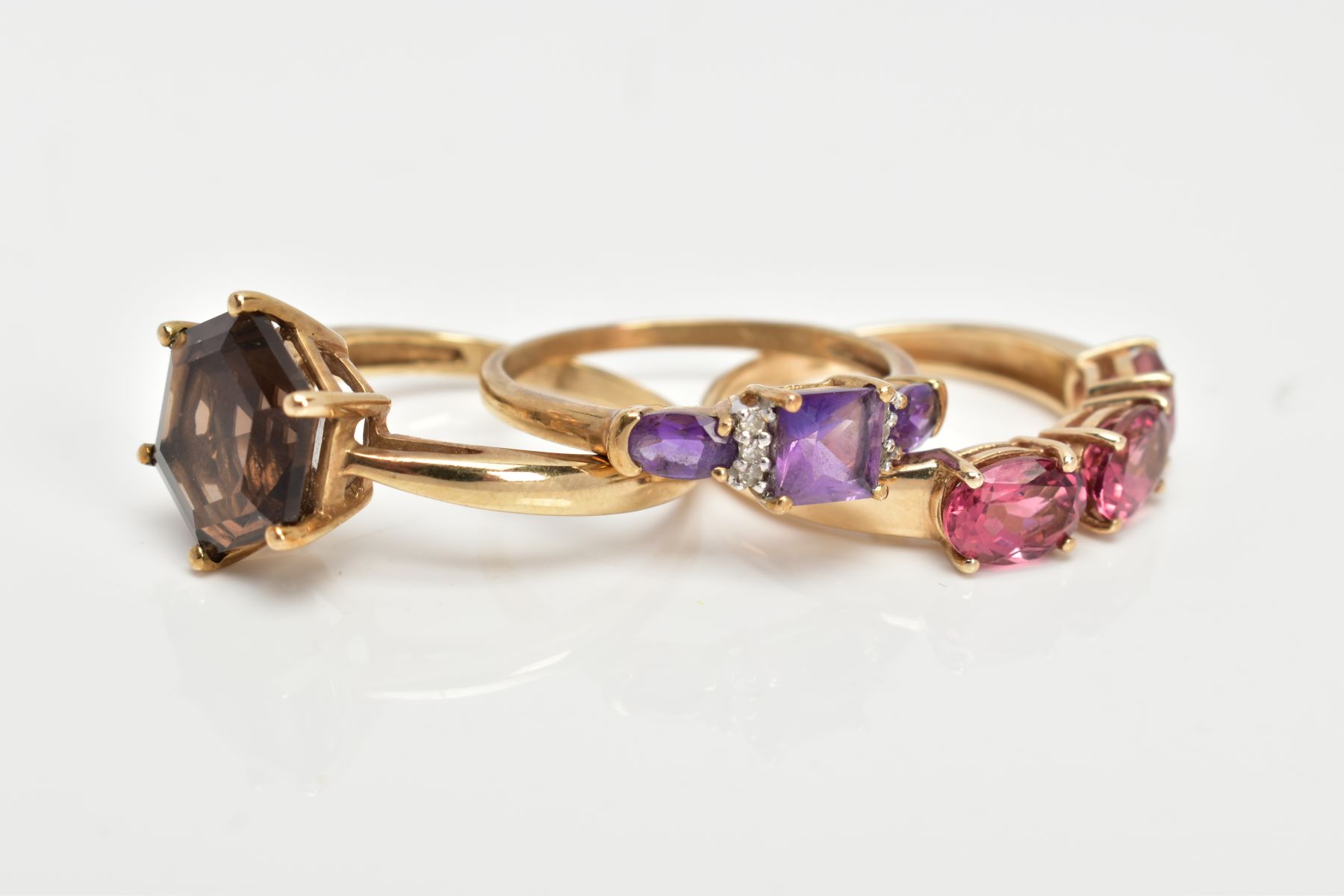 TWO 9CT GOLD GEM SET RINGS AND A YELLOW METAL AMETHYST AND DIAMOND RING, the first set with a - Image 2 of 3