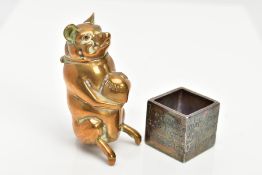 A NOVELTY BRASS PIG VESTA AND A SILVER-PLATED TRINKET, the vesta in the form of a standing pig