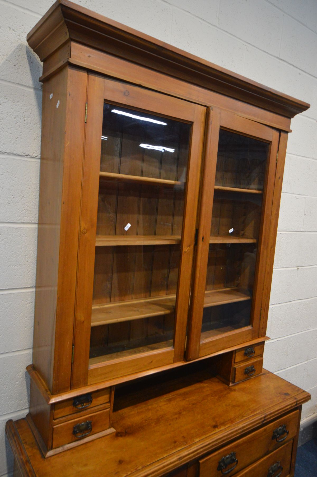 A LATE VICTORIAN PINE SIDEBOARD with a later glazed bookcase top, an arrangement of drawers and a - Image 2 of 3