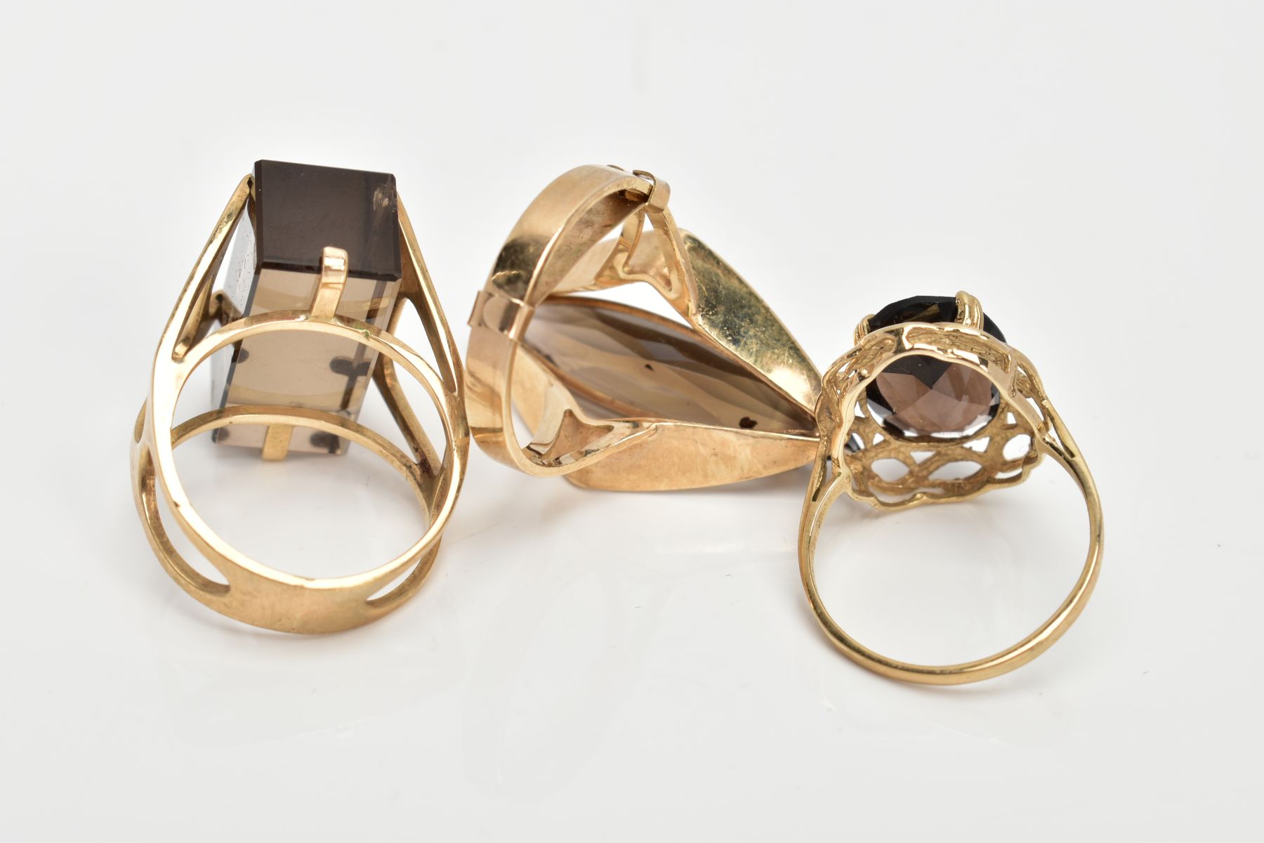 THREE 9CT GOLD SMOKEY QUARTZ DRESS RINGS, the first set with a rectangular cut Smokey quartz, - Image 3 of 3