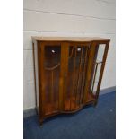 AN ART DECO WALNUT TWO DOOR CHINA CABINET, with two glass shelves, width 107cm x depth 35cm x height