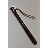 A WOODEN TRUNCHEON, stamped J Hudson & Co Birmingham, with some marking and wear, leather wrist