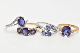 FOUR 9CT GOLD GEM SET DRESS RINGS, to include two white gold rings, set with Tanzanite and