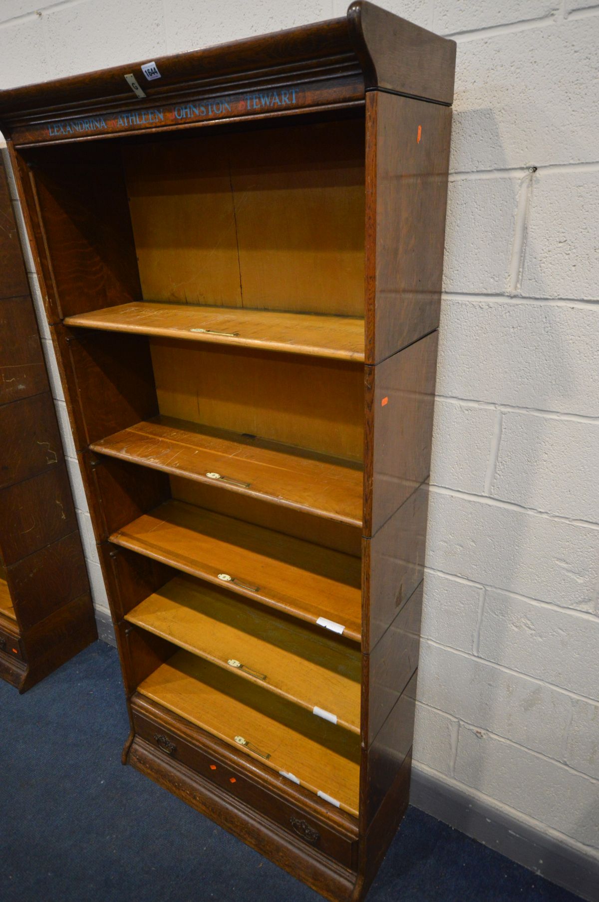 AN OAK FIVE SECTION BOOKCASE, with stencilled writing to top frieze, the bottom section with a - Image 3 of 3