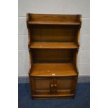 AN ERCOL GOLDEN DAWN WATERFALL OPEN BOOKCASE, with double cupboard doors, width 61cm x depth 35cm