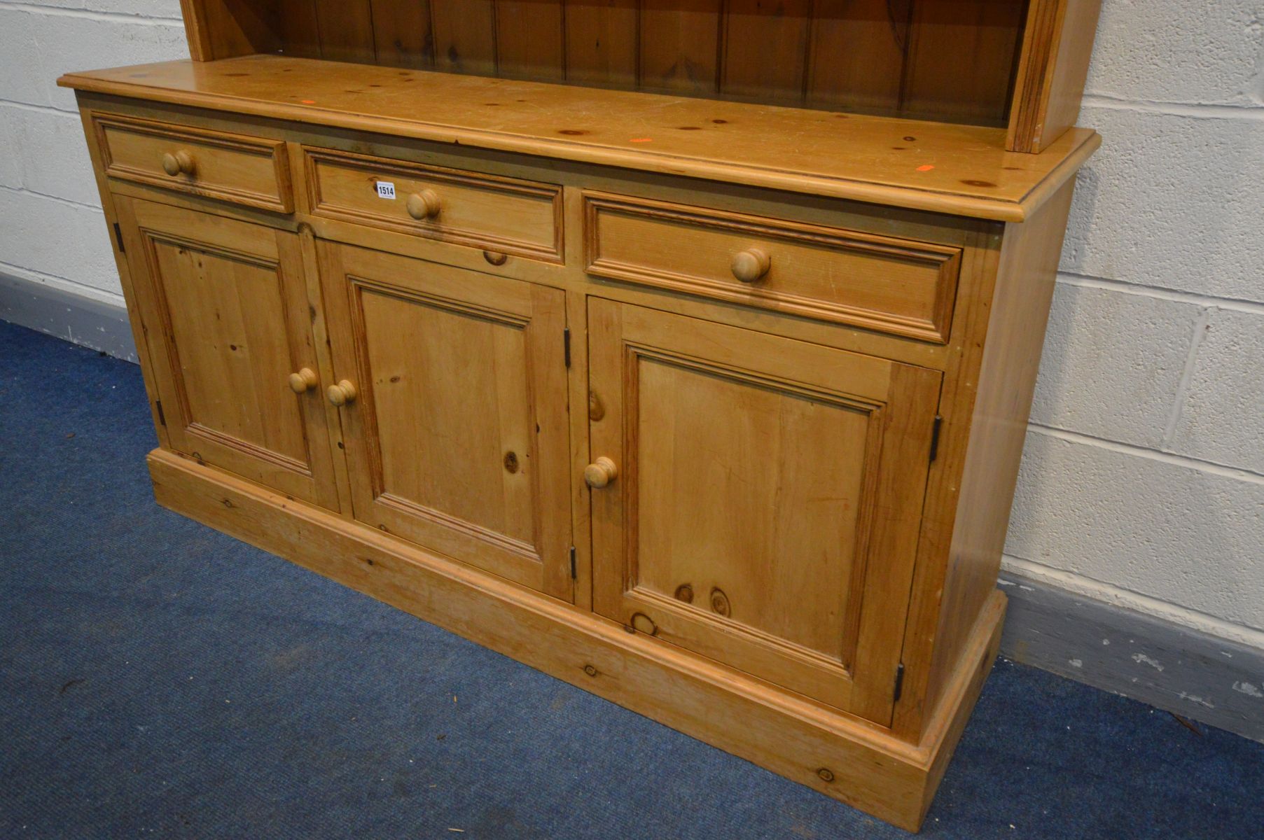 A PINE DRESSER with an arrangement of drawers above three cupboard doors, width 153cm x depth 41cm x - Image 2 of 2