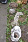 THREE COMPOSITE GARDEN ORNAMENTS comprising of a Grecian lady carrying a ewer 60cm high, a bird bath