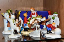 FIVE COALPORT CHARACTERS 'THE SNOWMAN' FIGURES AND TWO SIMILAR BY BESWICK, comprising a boxed