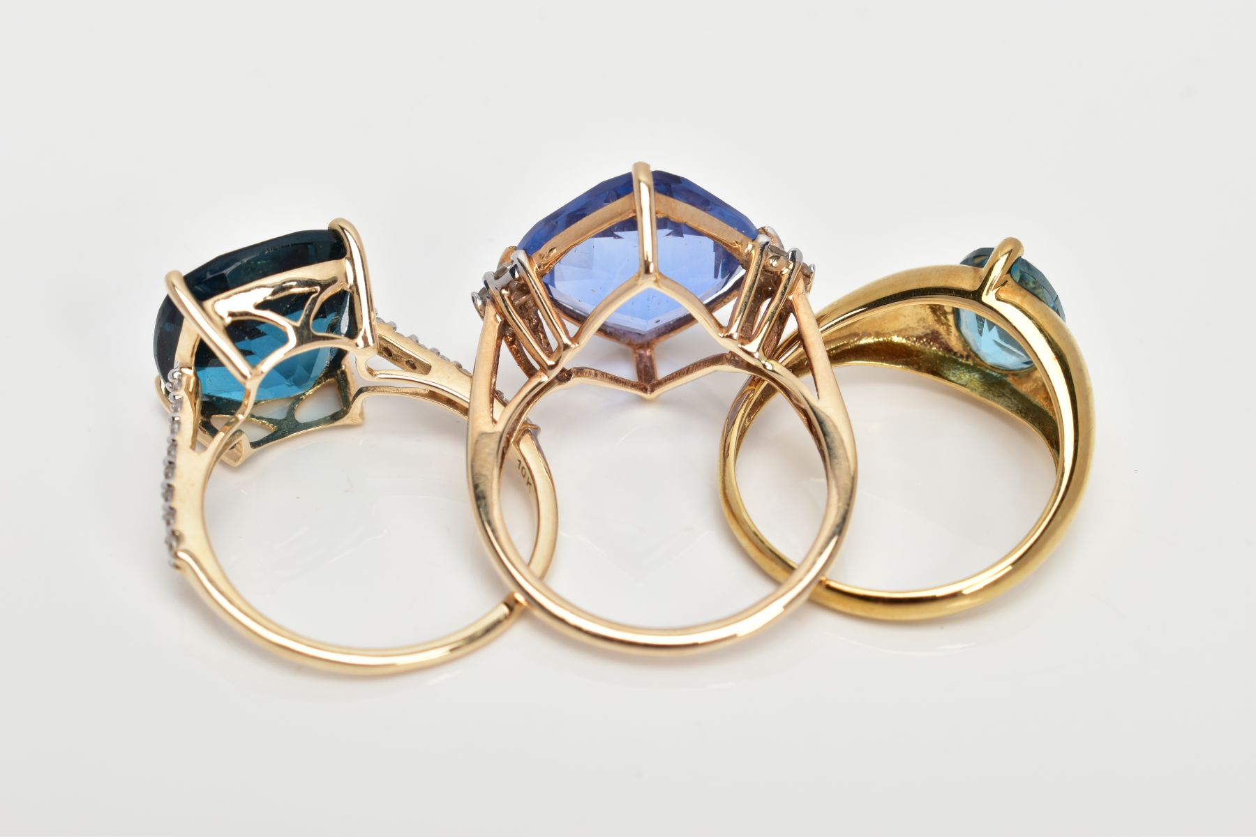 THREE 9CT GOLD GEM SET DRESS RINGS, each set with a vary cut blue stone possibly topaz/fluorite - Image 3 of 3