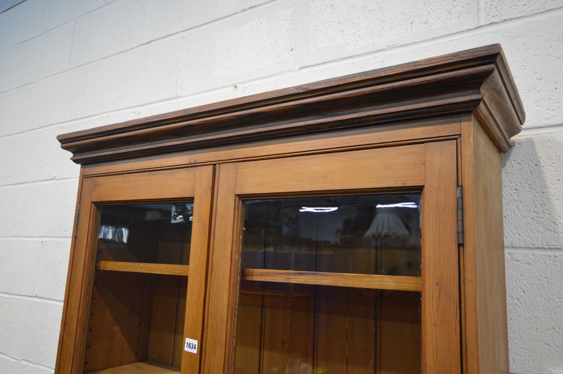 AN EARLY 20TH CENTURY PITCH PINE BOOKCASE, with double glazed doors enclosing five adjustable - Image 2 of 3