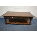 AN OAK WILLIS AND GAMBIER STYLE COFFEE TABLE with two drawers, undershelf and turned supports, width