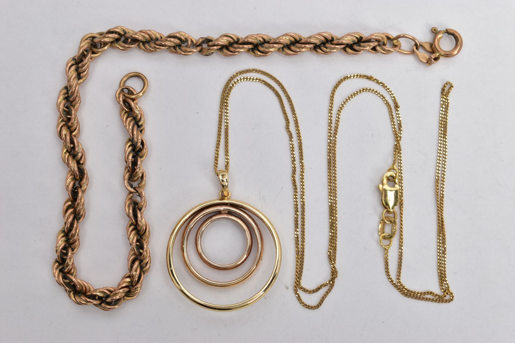 A 9CT GOLD PENDANT NECKLACE AND A ROPE TWIST BRACELET, the pendant of an openwork circular form, - Image 2 of 2