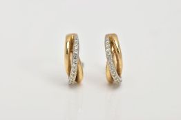 A PAIR OF YELLOW METAL DIAMOND HOOP EARRINGS, each of an openwork crossover style, set with round