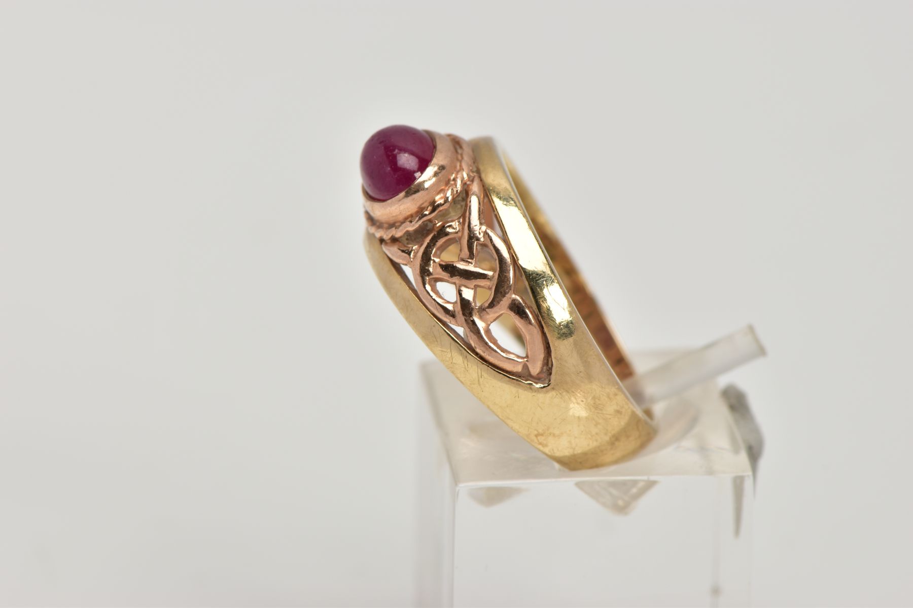 A 9CT GOLD 'CLOGAU' SIGNET RING, designed with a central oval ruby cabochon, collet mount with a - Image 2 of 5