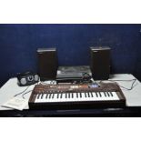 A VINTAGE CASIOTONE 403 KEYBOARD with rosewood effect case along with stand and manual, a vintage