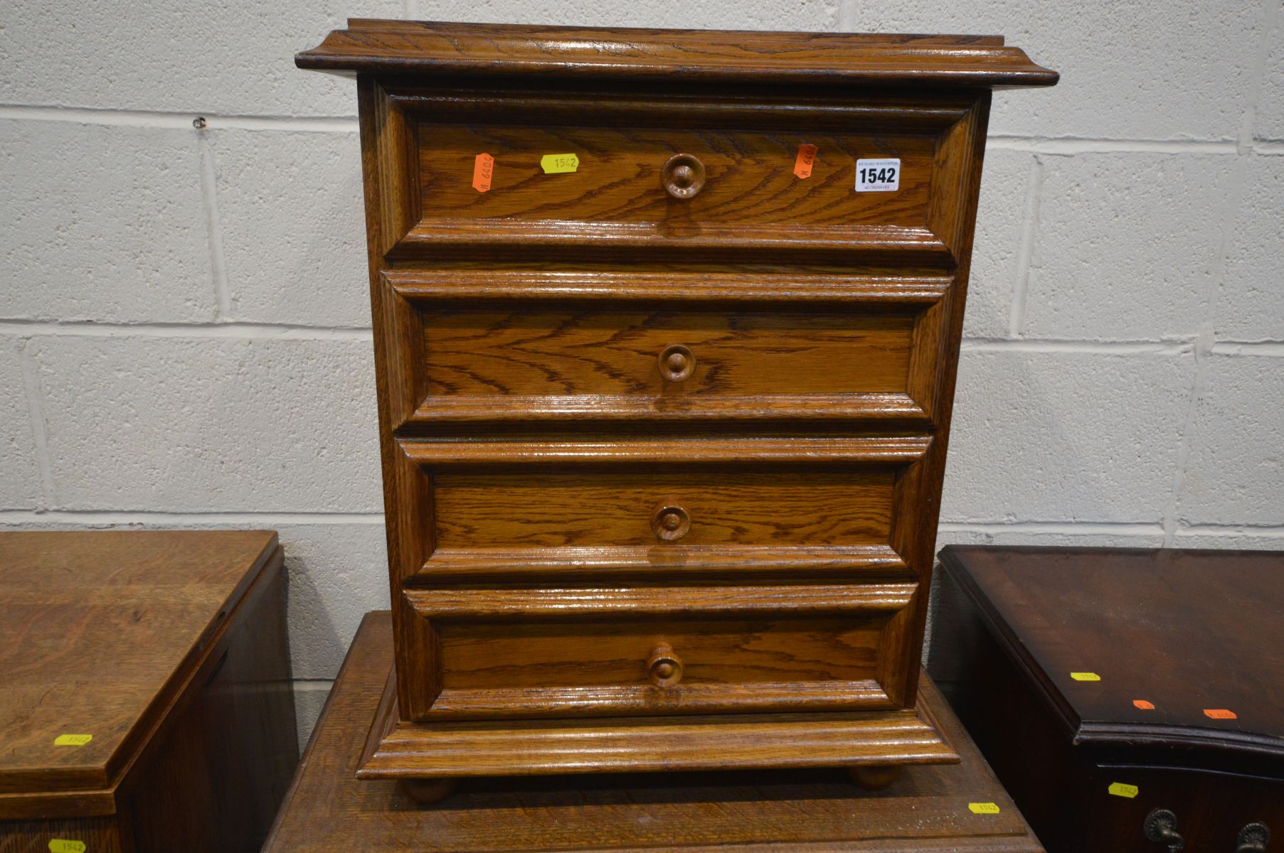 A MAHOGANY CHEST OF FOUR DRAWERS, along with an oak drop leaf tea trolley, German oak bedside - Image 3 of 3