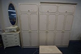 A CREAM FRENCH BEDROOM FITMENTS, comprising three double door wardrobes, four top sections, along