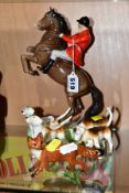 A BESWICK HUNTSMAN ON REARING HORSE, model no 868, style two, brown gloss, broken front leg loose,