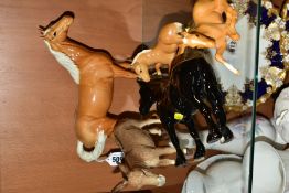 A BESWICK DONKEY AND FOUR BESWICK HORSES/FOALS, comprising a Swish Tail horse, model no 1182,