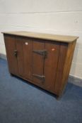 A SLATTED PINE SINGLE DOOR CUPBOARD, and a hinged top, width 98cm x depth 48cm x height 78cm -