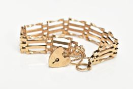 A 9CT GOLD GATE BRACELET, fitted with a heart clasp with an additional safety chain, hallmarked