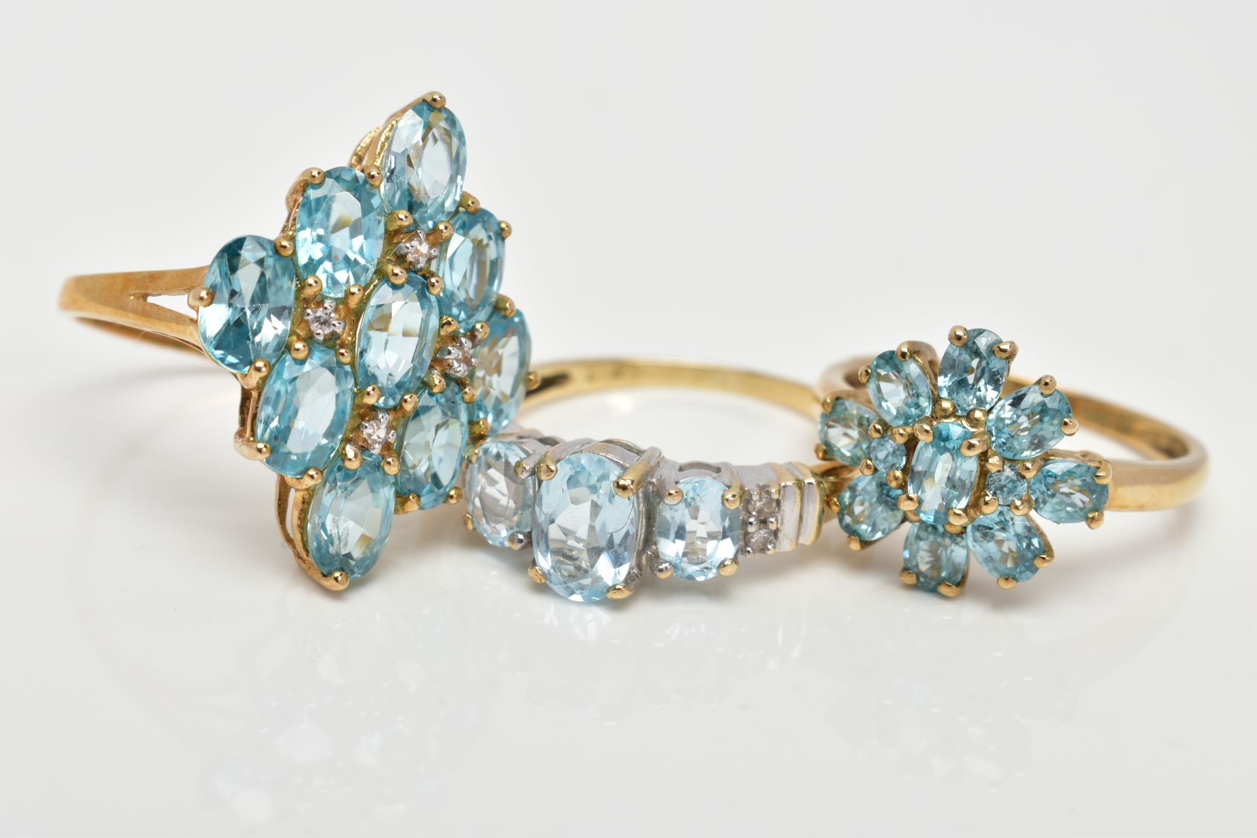 THREE 9CT GOLD BLUE TOPAZ DRESS RINGS, two designed as clusters, ring sizes O, hallmarked 9ct gold - Image 2 of 3
