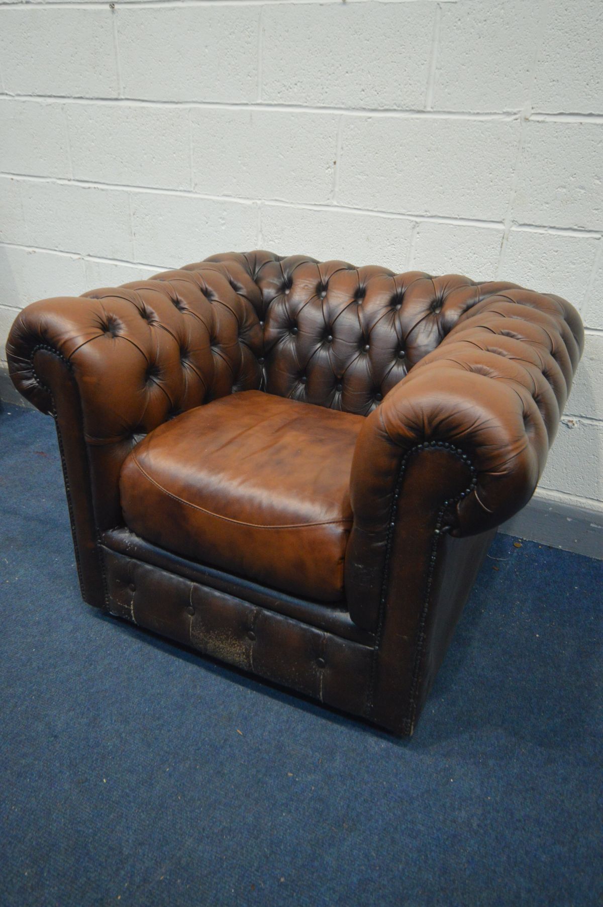 A BROWN LEATHER CHESTERFIELD CLUB CHAIR, width 101cm x depth 84cm x height 73cm (condition:- pet - Image 2 of 2