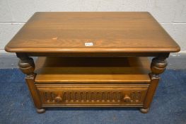 AN ERCOL GOLDEN DAWN TV STAND, with a corner drop leaf, and a single drawer, width 75cm x closed