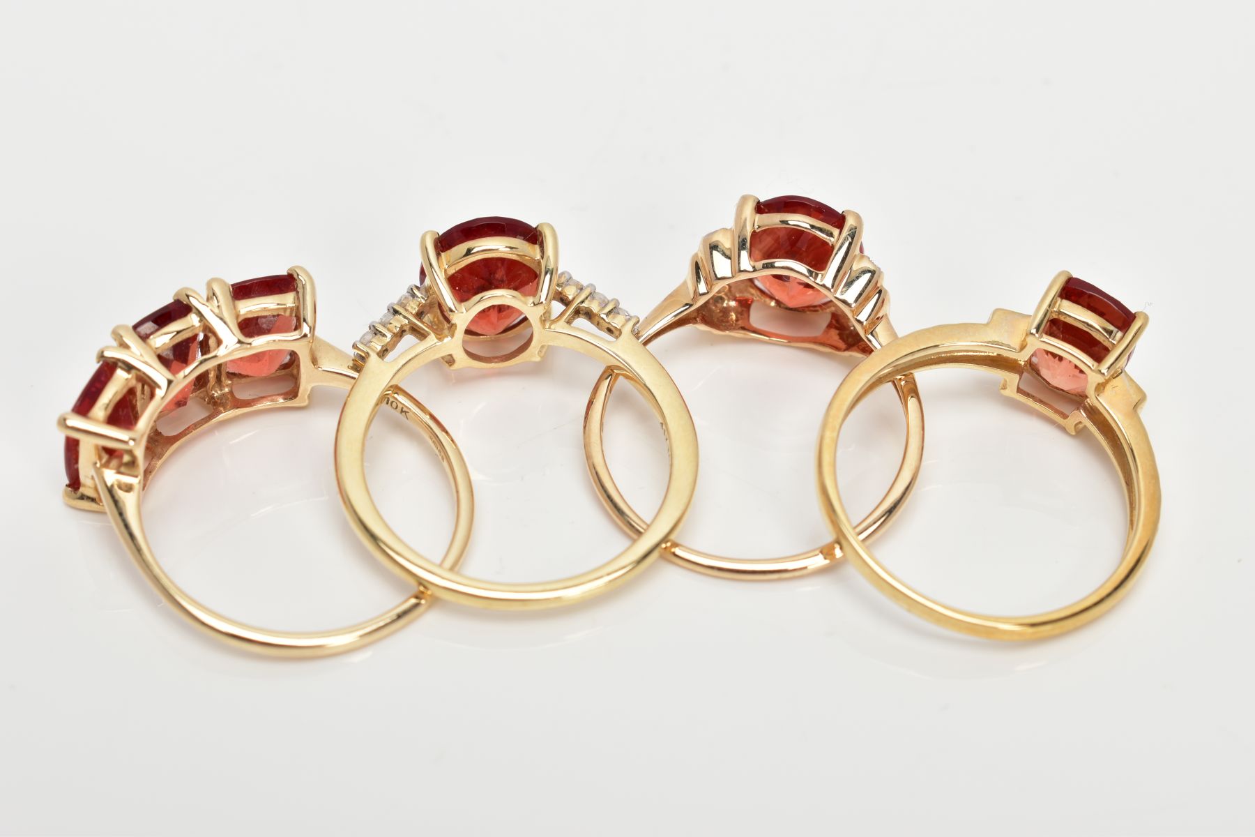 FOUR 9CT GOLD GEM SET RINGS, each set with orangish red stones possibly organ sunstone/Andesine, - Image 3 of 3