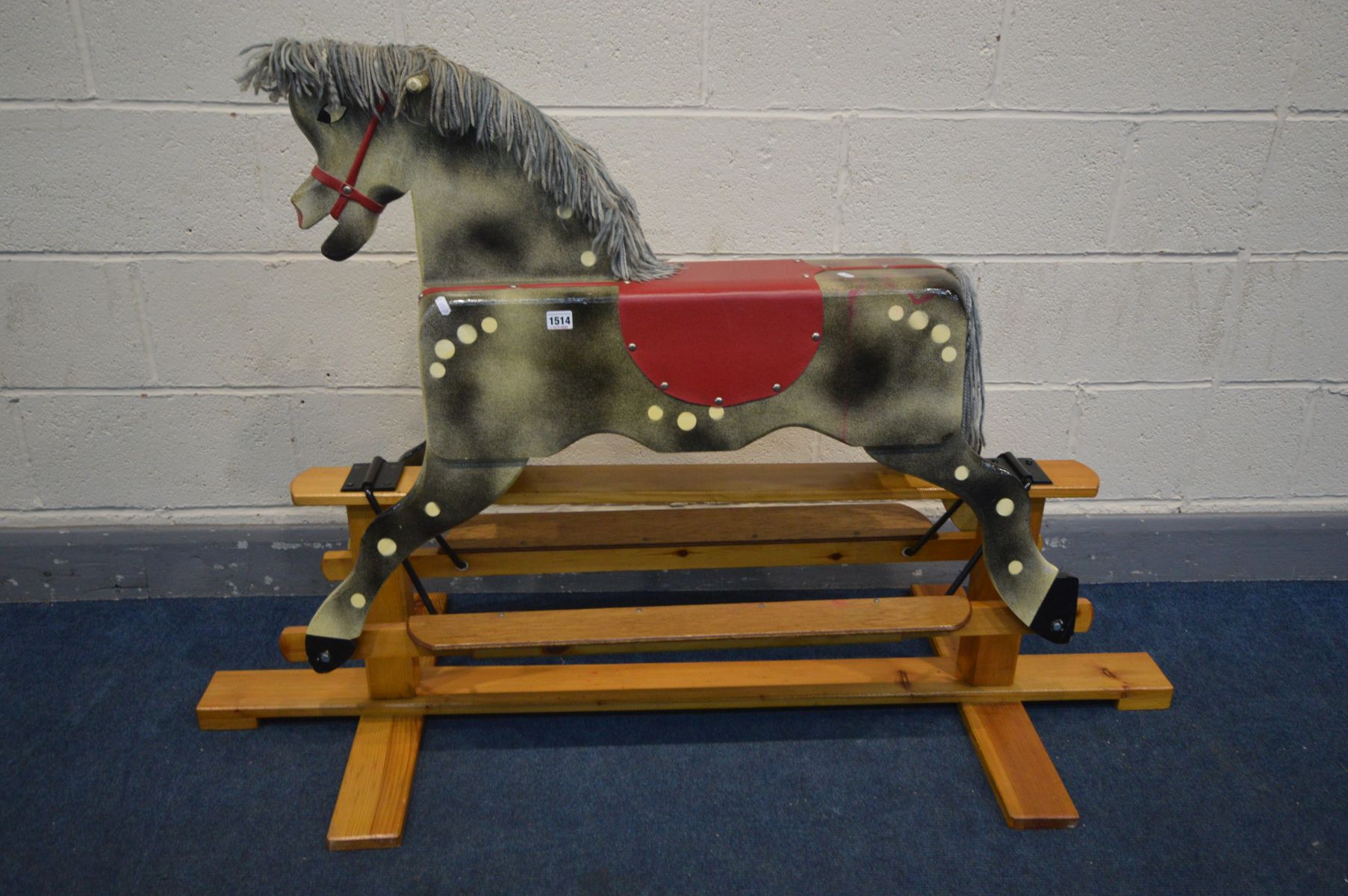 A BESPOKE TRESTLE ROCKING HORSE, on a pine stand, length 148cm x depth 59cm x height 97cm (condition