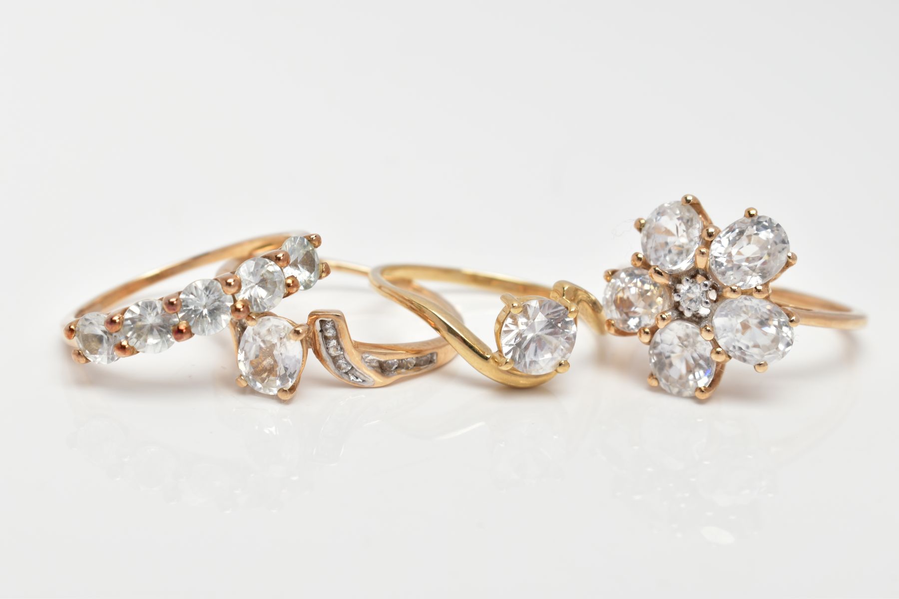 FOUR 9CT GOLD COLOURLESS ZIRCON SET DRESS RINGS, each with a 9ct gold hallmark for Birmingham, - Image 2 of 3