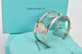 A 'TIFFANY & CO' BANGLE, wide openwork cuff with heart detail, signed 'Tiffany & Co, 925',