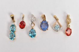 FIVE GEM SET YELLOW METAL PENDANTS, the first set with two oval cut blue topaz, fitted with a